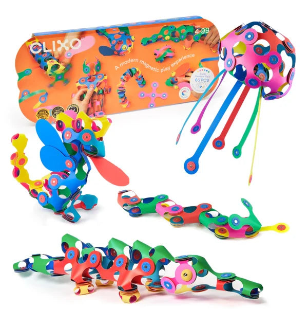 Rainbow magnetic building set with orange box and creations including a jellyfish, dragon, and segmented snakes.