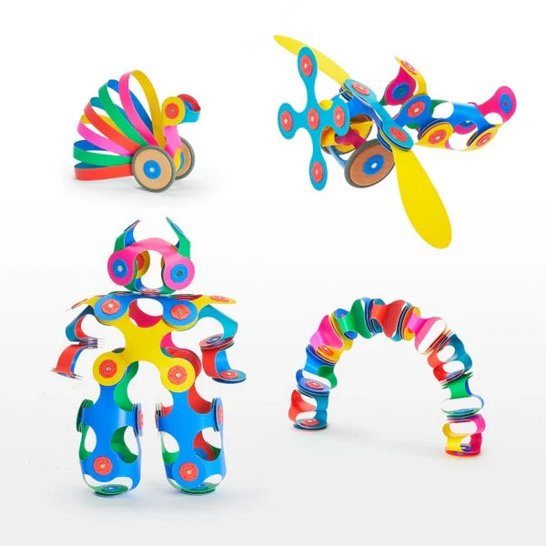 Four colorful toy builds including a robot and airplane made from flexible magnetic pieces and wheels.