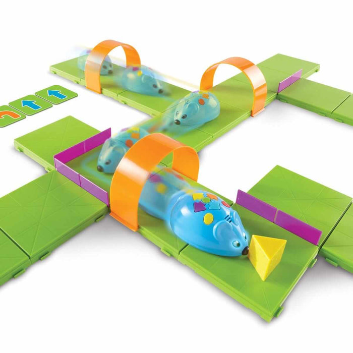 Blue robot mouse navigates a maze of green tiles, orange arches, and purple walls toward a yellow cheese wedge.