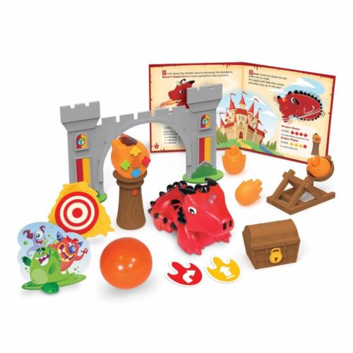Red dragon toy with grey castle arch, catapult, treasure chest, orange ball, and colorful coding accessories.