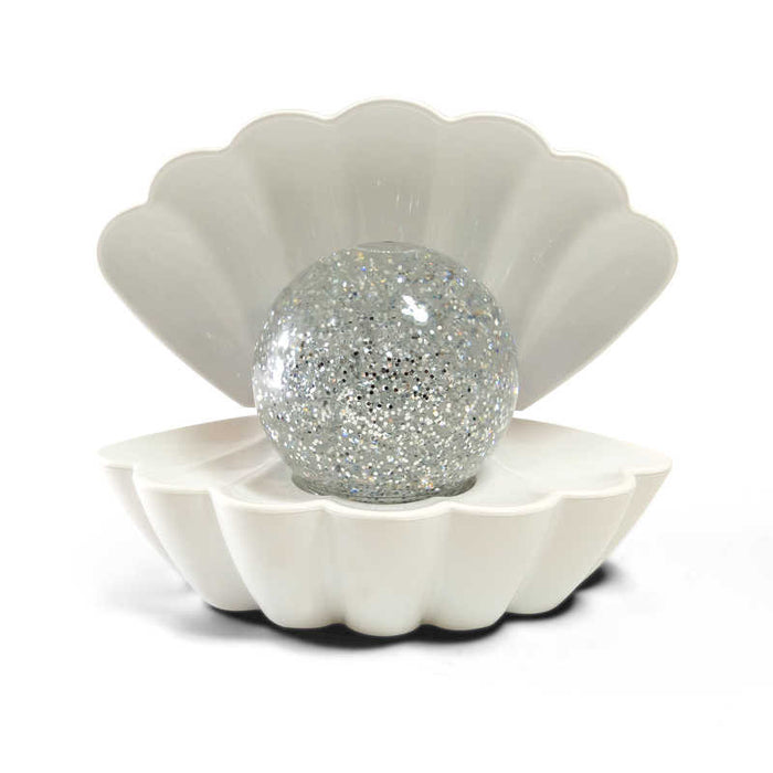 White open clam shell housing a round sphere filled with sparkling silver glitter.