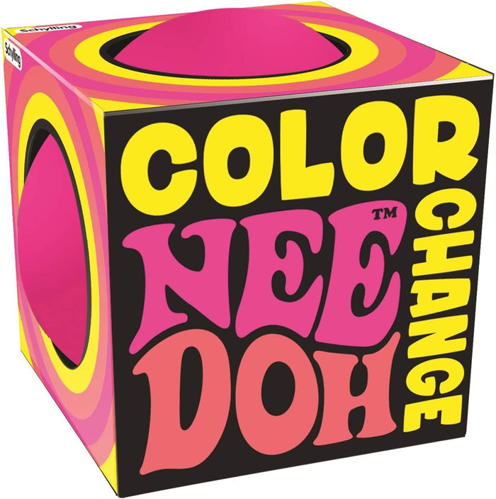 Black cube box with yellow and pink retro graphics. Circular cutouts show a vibrant pink squishy ball inside.