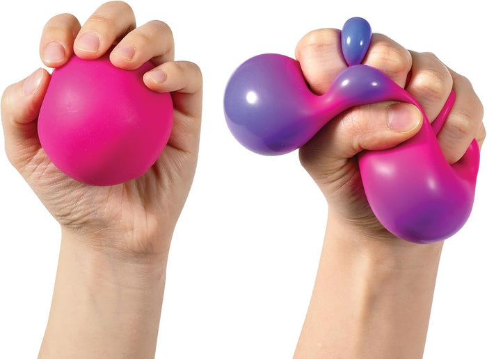 Hand holding a round pink ball and another hand squeezing it to show a bulging purple color-changing effect.