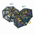 Two black umbrellas showing dry white dinosaur prints turning into bright colors when wet.