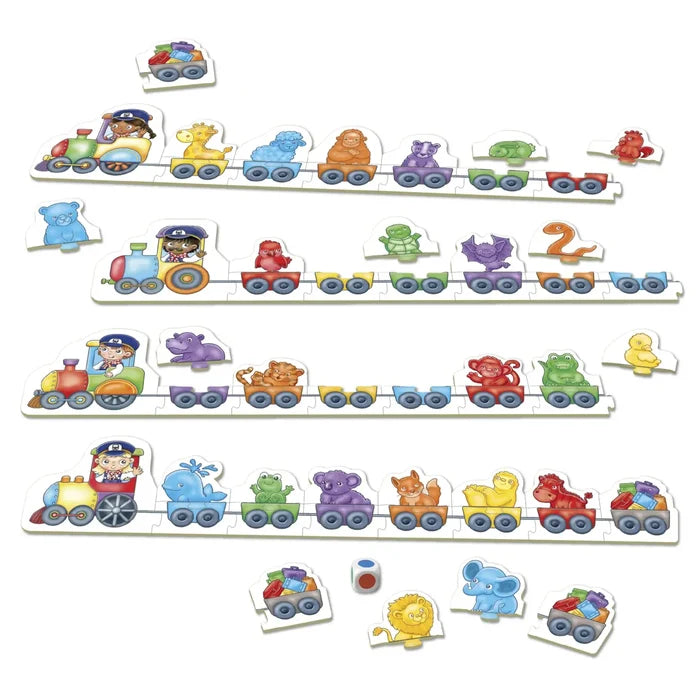 Four colourful puzzle trains with animal-shaped carriages, loose pieces, and a game die on a white background.