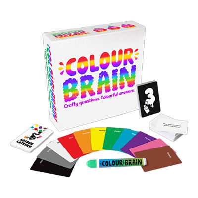 White game box with rainbow bubble letters, fan of multi-colored cards, game decks, and a branded pen on white.