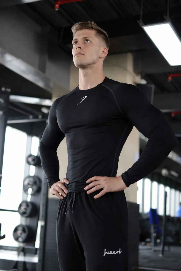 Black compression full-sleeves T-shirt by Fuaark Nz, shown laid flat with smooth fabric and fitted design.