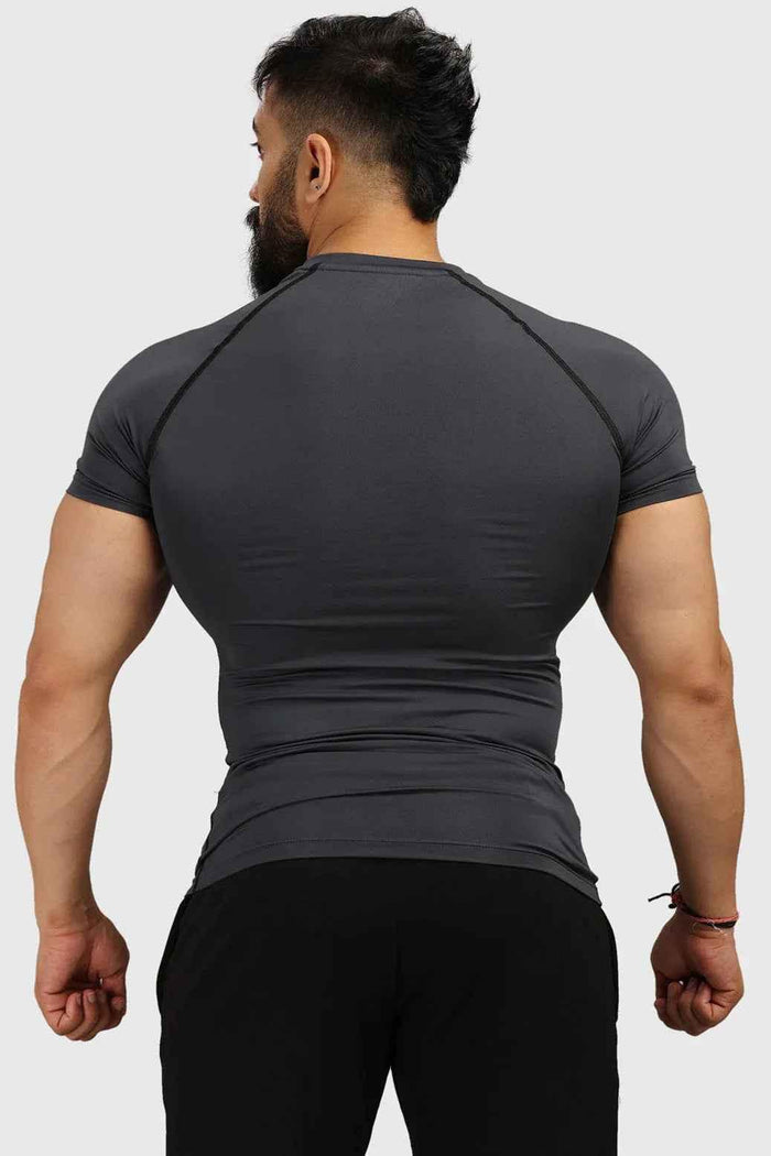Grey compression T-shirt from Fuaark Nz, showcasing a snug fit and breathable fabric for athletic performance.
