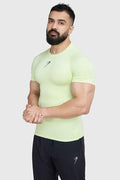 Fuaark Nz lime compression T-shirt for men, close-up of fitted athletic shirt with logo and breathable fabric.