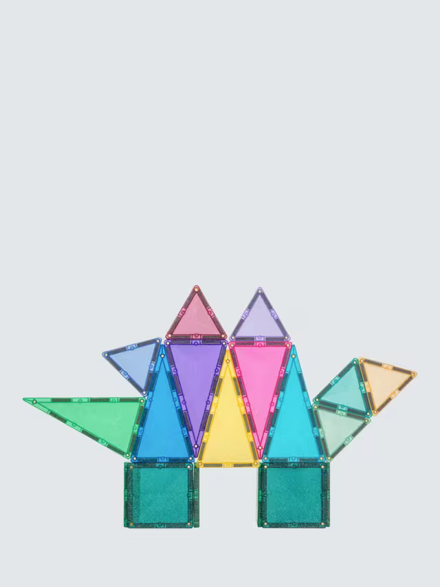 A colorful dinosaur made of glittery magnetic triangles and squares on a light grey background.