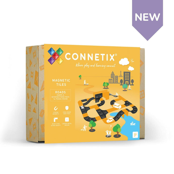 Yellow packaging for magnetic road tiles featuring black ramps and intersections in a colorful cartoon city landscape.