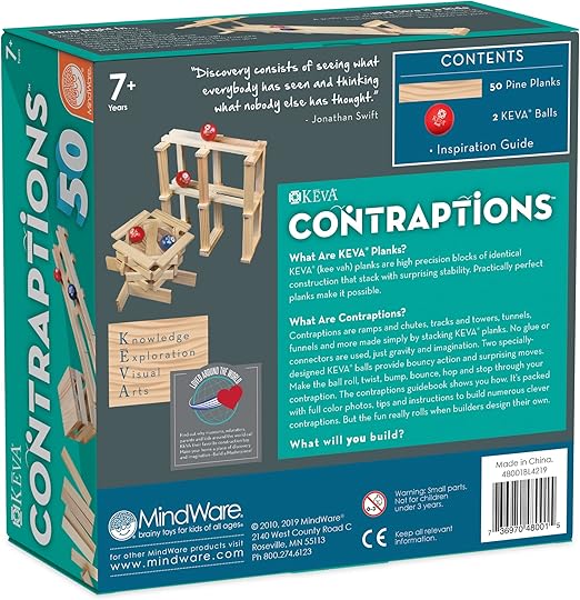 Teal packaging for KEVA building set showing wooden plank towers, red balls, and product contents for ages 7 and up.