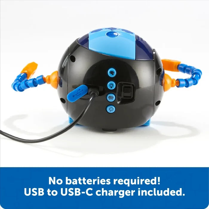 Spherical black robot with flexible blue and orange arms charging via USB-C. Text: No batteries required.
