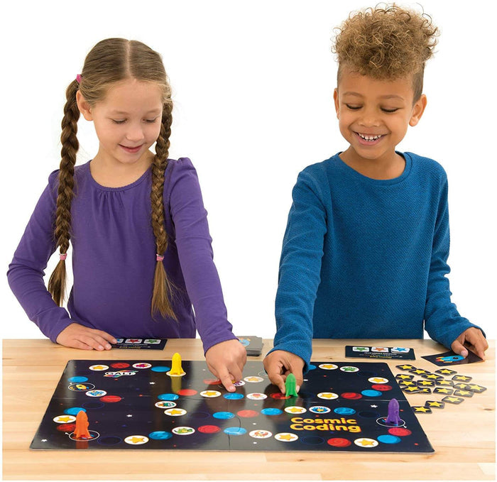 Two children play a space board game with colorful rocket pieces and round planet spaces on a dark starry board.
