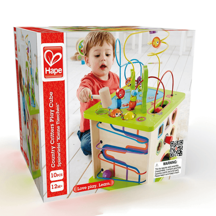 Box for wooden activity play cube showing a child playing with colorful bead mazes, tracks, and a mallet.