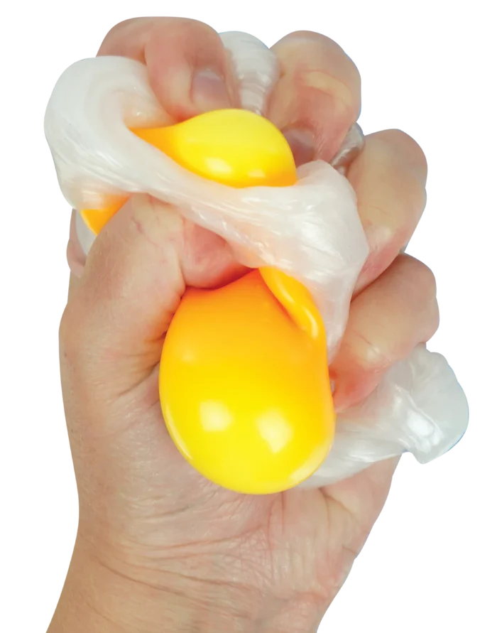 Hand squeezing bright yellow and translucent white putty that looks like a raw egg.
