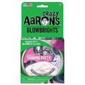 Green carded packaging for a round tin of white iridescent putty with a white unicorn illustration.