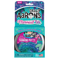 Sparkly blue and purple putty in a tin, inside a teal mermaid-themed box with glow-in-the-dark text.