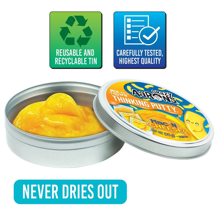 Yellow-orange putty in an open silver tin with a branded lid, quality icons, and a blue Never Dries Out banner.