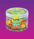 Clear plastic jar filled with colorful slime and charms, featuring a dinosaur label on a purple backdrop.