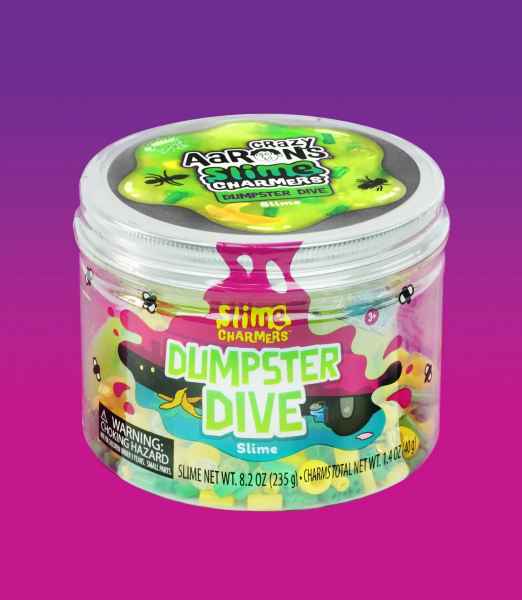 Clear jar of neon green and yellow slime with small trash charms and a pink drip label against a purple background.
