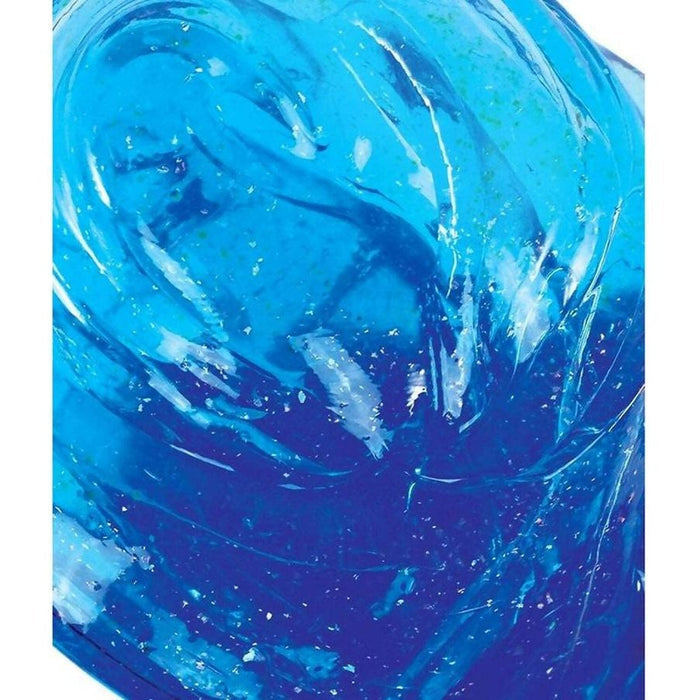 Close-up of translucent, swirling blue putty with silver glitter and a glossy, viscous texture.