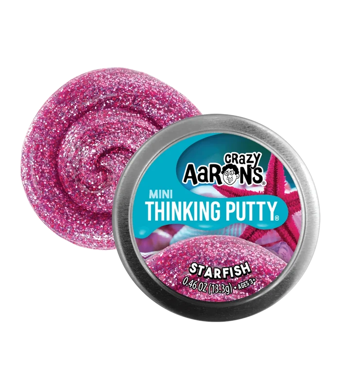 Sparkly pink glitter putty swirl next to a small silver tin with a teal label and starfish graphic.