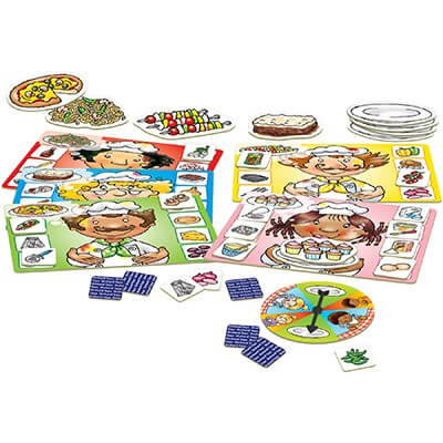 Cartoon chef board game with character boards, food ingredient tiles, a spinner, and illustrated food cutouts.