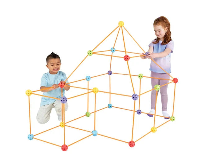 Two children building a geometric fort frame with orange rods and multicolored spherical connectors.