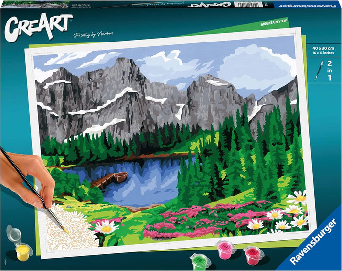Art kit box featuring a mountain landscape with a lake, paint pots, and a hand painting white and pink flowers.