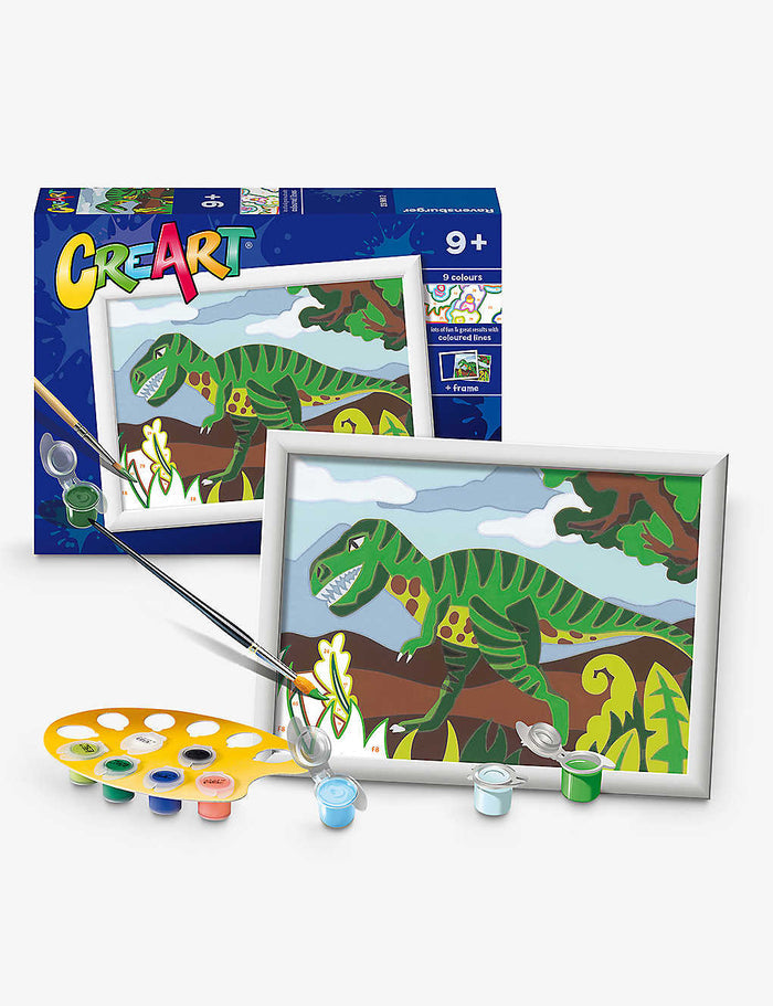 A framed green T-Rex paint-by-numbers kit with a yellow paint palette, brush, and colorful paint pots.