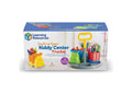 Box for a kids' art organizer featuring three colorful truck-shaped cups on a rotating base with a yellow handle.