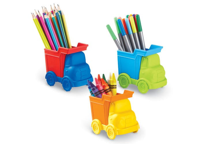 Three colorful plastic dump truck desk organizers holding colored pencils, markers, and crayons.