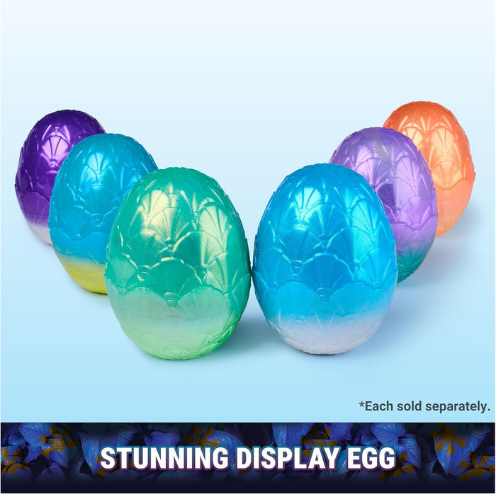 Six iridescent, scaly toy eggs in vibrant colors like blue, green, and purple, arranged in a V-shape.