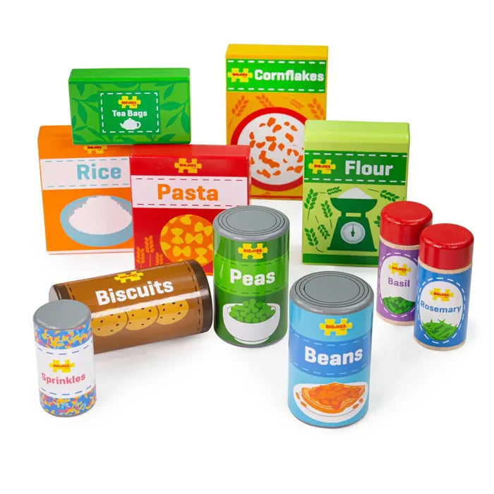 Colorful wooden toy grocery set with labeled boxes, cans, and jars of staples like pasta, flour, peas, and biscuits.