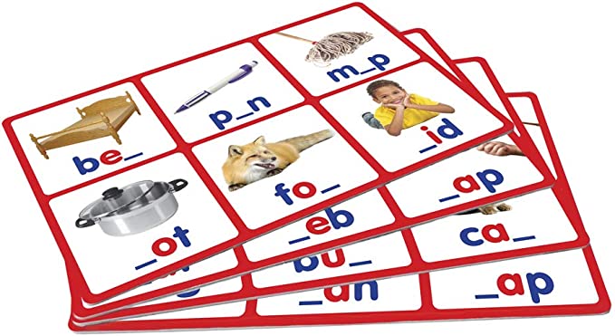 Three red-bordered bingo cards showing pictures like a bed and pen next to incomplete three-letter words.