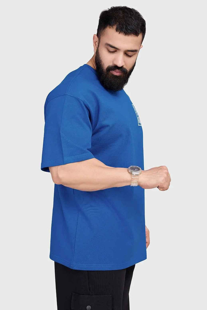 Royal blue Dapper oversized T-shirt by Fuaark Nz, shown flat with relaxed fit and short sleeves.