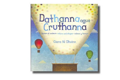 Book cover with a large dotted hot air balloon and smaller red and green balloons floating in a blue sky.