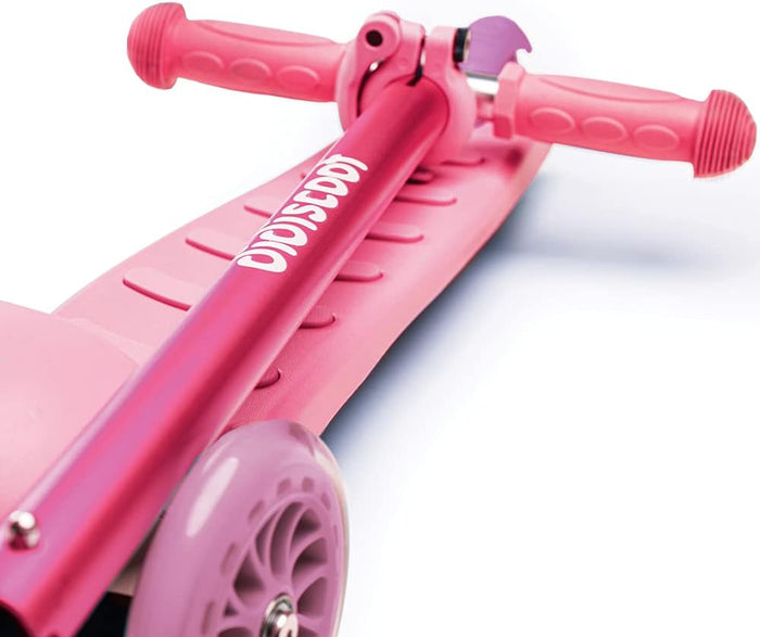 Close-up of a pink kick scooter featuring textured handlebar grips, a ridged deck, and a pink front wheel.
