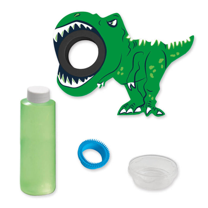 Green dinosaur bubble kit featuring a T-Rex cutout, bottle of solution, blue textured wand, and clear plastic dish.