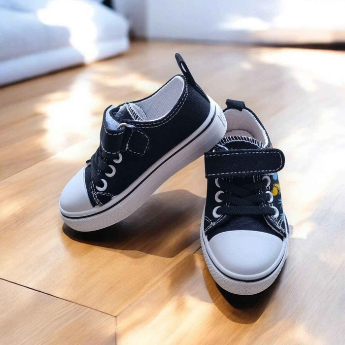 Colorful DinoTeam Canvas Sneakers by Happy Feet NZ, showcasing vibrant patterns and a comfortable fit for kids.
