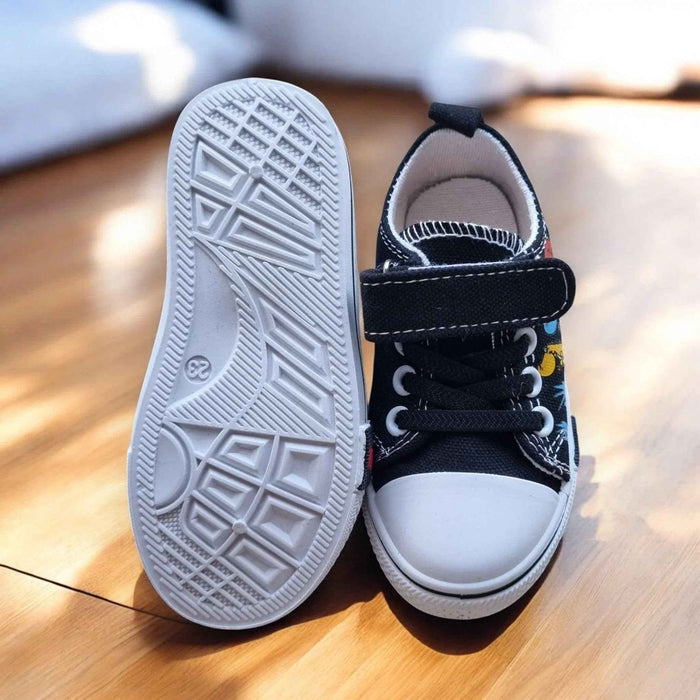 Colorful DinoTeam Canvas Sneakers from Happy Feet NZ featuring vibrant patterns and comfortable design for kids.