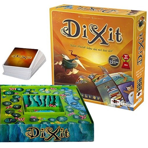 Orange Dixit board game box with whimsical art, a stack of cards, and a green and blue numbered scoring board.