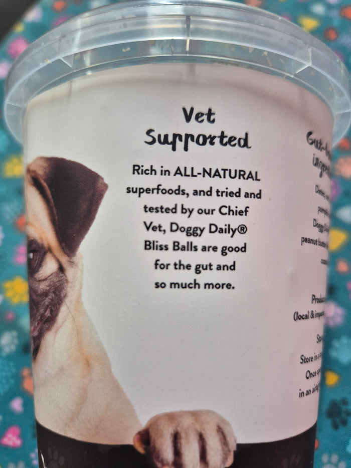 Doggy Daily Bliss Balls by Animal Addiction Limited, healthy dog treats with natural ingredients, shown in a close-up image.
