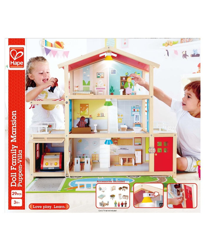 Three-story wooden dollhouse packaging featuring a red roof, four dolls, furniture, and working interior lights.