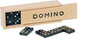 Black domino tiles with white dots and a light-colored wooden sliding-lid box printed with DOMINO in black.