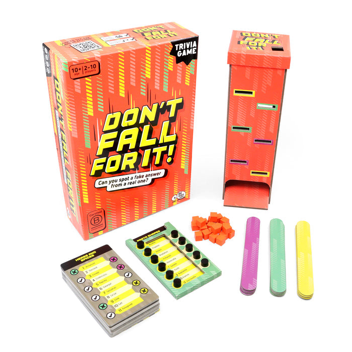 Orange game box with a tall cardboard tower, trivia cards, colorful sticks, and small orange cubes.