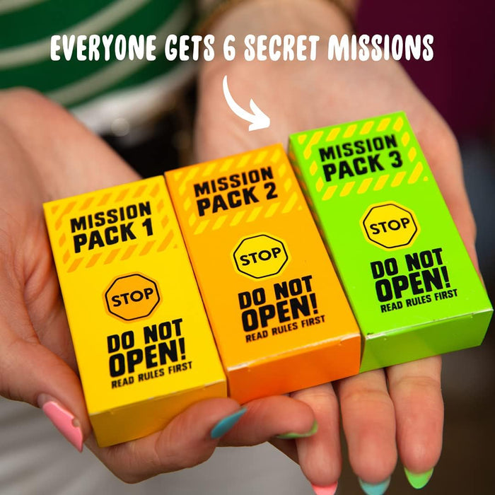 Hands holding small yellow, orange, and green Mission Pack boxes. Text: Everyone gets 6 secret missions.