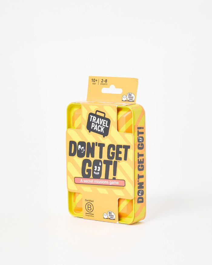 Yellow and orange striped metal travel tin for Don't Get Got with a black suitcase icon and character eyes.