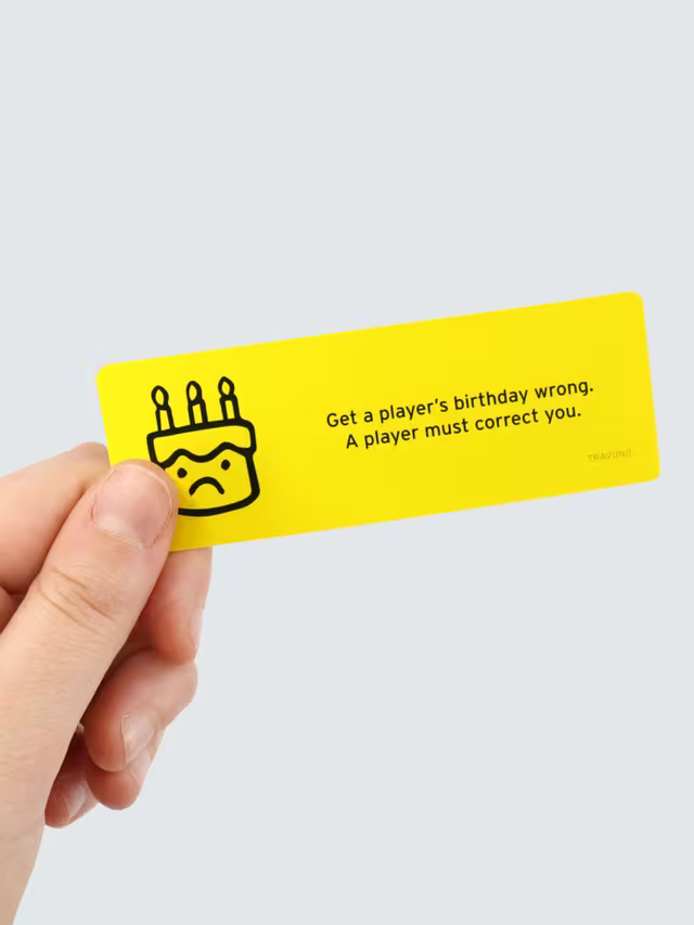 Hand holding a yellow card with a sad cake icon and text: Get a player's birthday wrong. A player must correct you.